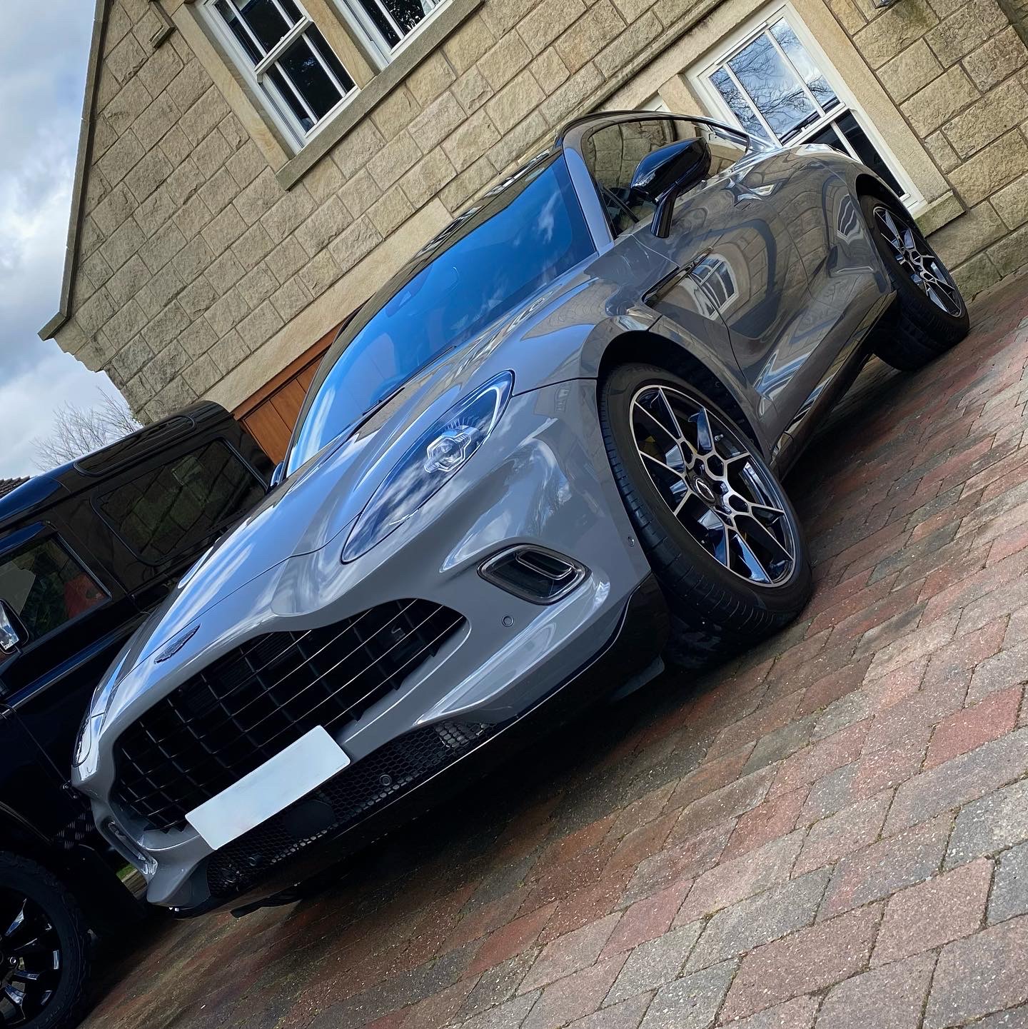 Silver Aston Martin after a Full Day Detail and paint enhancement