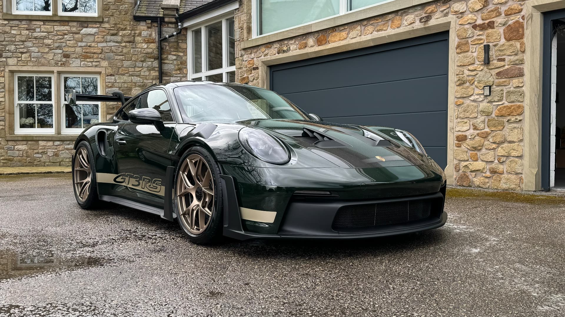 Porsche 911 GT3 RS freshly cleaned on a customer driveway