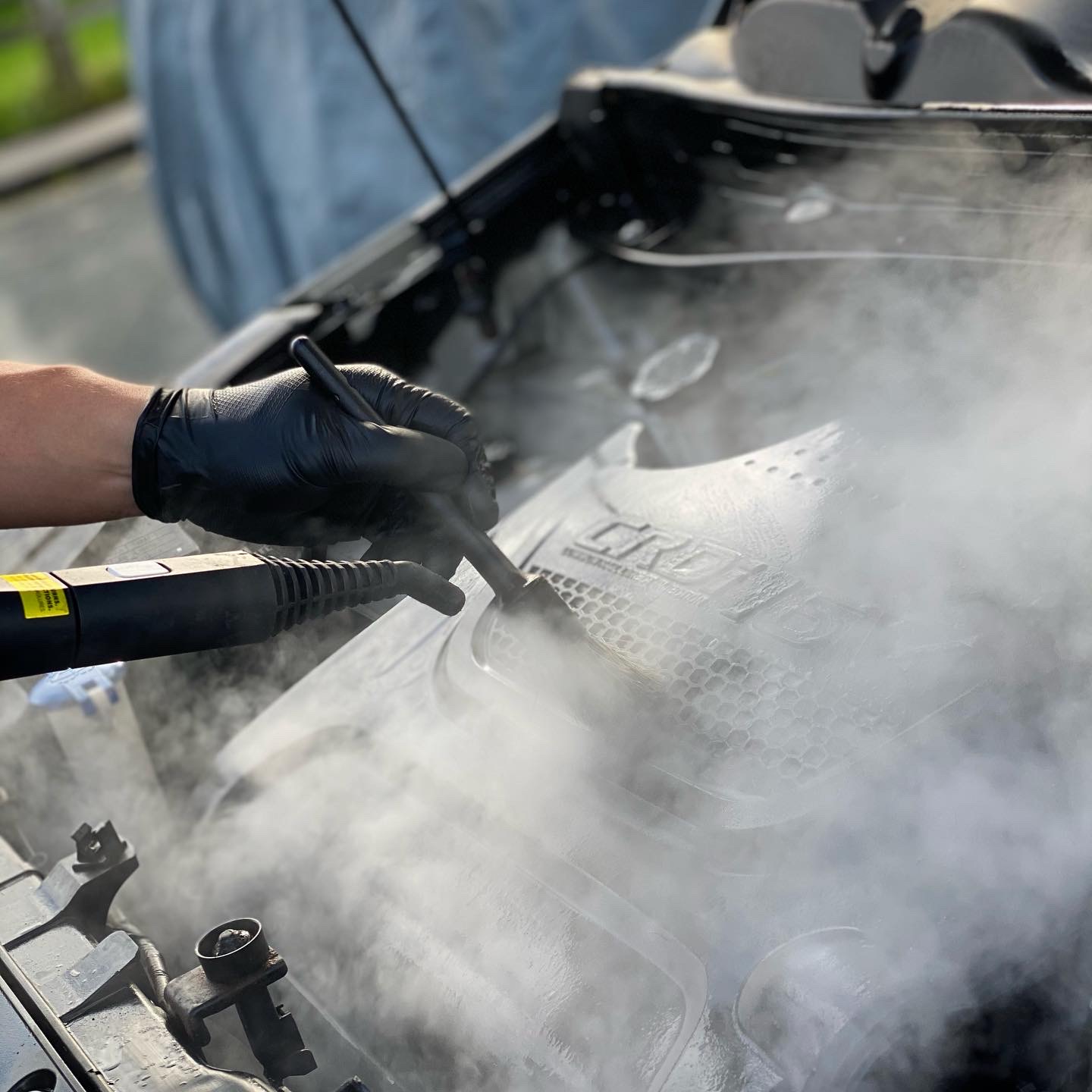 Steam cleaning an engine bay during a Deep Clean